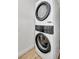 Efficient laundry area with stacked washer and dryer, maximizing space for convenience at 220 Village Overlook # K2, Canton, GA 30114