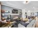 Open-concept living room with a modern fireplace and seamless flow to the kitchen and dining area at 220 Village Overlook # K2, Canton, GA 30114