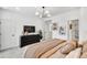 Relaxing main bedroom showcasing a dresser, wall art, and soft, neutral decor and furnishings at 220 Village Overlook # K2, Canton, GA 30114