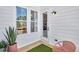 Cozy back patio with charming decor, ideal for outdoor dining and relaxation at 220 Village Overlook # K2, Canton, GA 30114