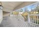 A spacious covered porch with a view of the property's landscape and surrounding neighborhood at 437 Westmeath Sw Dr, Atlanta, GA 30310