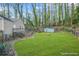 Serene backyard featuring lush lawn and private wooded border, great for outdoor enjoyment at 437 Westmeath Sw Dr, Atlanta, GA 30310