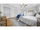 Bright bedroom with large windows, tray ceiling, and blue accent chairs offers serene retreat at 437 Westmeath Sw Dr, Atlanta, GA 30310