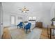 Bright bedroom with large windows, tray ceiling, and blue accent chairs offers serene retreat at 437 Westmeath Sw Dr, Atlanta, GA 30310