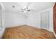 Spacious bedroom featuring hardwood floors, two closets and a ceiling fan at 437 Westmeath Sw Dr, Atlanta, GA 30310
