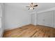 Bright bedroom with hardwood floors, two closets, and a ceiling fan at 437 Westmeath Sw Dr, Atlanta, GA 30310