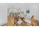 Inviting dining room with hardwood floors and open-concept design connecting to the kitchen at 437 Westmeath Sw Dr, Atlanta, GA 30310
