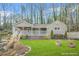 Charming single-story home with a inviting front porch and well-manicured lawn surrounded by mature trees at 437 Westmeath Sw Dr, Atlanta, GA 30310