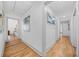 Bright hallway with hardwood floors and modern artwork creates an inviting atmosphere at 437 Westmeath Sw Dr, Atlanta, GA 30310
