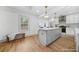 Bright kitchen featuring a large center island, modern appliances, and hardwood floors at 437 Westmeath Sw Dr, Atlanta, GA 30310