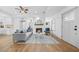 Bright living room featuring a cozy fireplace, modern furniture, and hardwood floors at 437 Westmeath Sw Dr, Atlanta, GA 30310