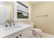 Clean bathroom featuring a modern sink, a large mirror and minimalist hardware at 3119 Windfield Cir, Tucker, GA 30084