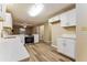 Modern kitchen with white cabinets, stainless steel appliances, and quartz countertops at 3119 Windfield Cir, Tucker, GA 30084