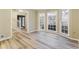 Sun-drenched living room with stylish wood-look floors and staircase at 3119 Windfield Cir, Tucker, GA 30084