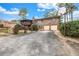 Spacious backyard with brick house, including a two-car garage, enclosed porch, and a basketball hoop at 3354 Wakefield Dr, Decatur, GA 30034