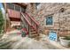 Backyard view showcasing the brick exterior and outdoor staircase, adding character to the home at 3354 Wakefield Dr, Decatur, GA 30034