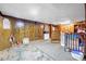 Unfinished basement with concrete floor and wood paneled walls at 3354 Wakefield Dr, Decatur, GA 30034