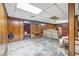 Unfinished basement with concrete floor and wood paneled walls at 3354 Wakefield Dr, Decatur, GA 30034