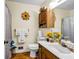 Bathroom featuring a white sink and toilet with wood-look floors at 3354 Wakefield Dr, Decatur, GA 30034
