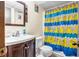Modest bathroom featuring a single sink vanity and a shower with a playful duck-themed curtain at 3354 Wakefield Dr, Decatur, GA 30034