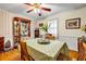 Traditional dining room with crown molding, a ceiling fan, a china cabinet, and natural light at 3354 Wakefield Dr, Decatur, GA 30034