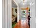 Inviting foyer featuring hardwood floors, decorative metal security door, and a glimpse into the adjacent living room at 3354 Wakefield Dr, Decatur, GA 30034