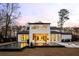 Back exterior featuring sleek black trim, backyard pool, outdoor lounge area, and a covered patio perfect for entertaining at 185 Pebble Trl, Alpharetta, GA 30009