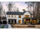 Stunning modern home boasts a striking facade with a garage and professional landscaping at 185 Pebble Trl, Alpharetta, GA 30009