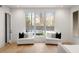 Main bedroom sitting area with pool view from large windows at 185 Pebble Trl, Alpharetta, GA 30009