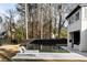 This modern pool and spa are surrounded by lounge chairs and a stained fence at 185 Pebble Trl, Alpharetta, GA 30009