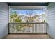 Balcony showcasing a neighborhood view framed by lush greenery at 406 Vinings Forest Se Cir, Smyrna, GA 30080