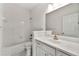 Well-lit bathroom with a combination tub and shower, ample vanity space and neutral color scheme at 406 Vinings Forest Se Cir, Smyrna, GA 30080