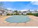 Neighborhood pool area with a covered pool, surrounding townhomes, and landscaping at 406 Vinings Forest Se Cir, Smyrna, GA 30080