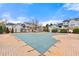 View of a neighborhood pool area with a pool covered for the off-season at 406 Vinings Forest Se Cir, Smyrna, GA 30080