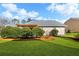 Lush backyard with manicured lawn, mature trees, and charming wooden pergola at 164 Owens Farm Ln, Woodstock, GA 30188