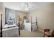 Comfortable bedroom featuring two twin beds with white linens, and neutral walls at 164 Owens Farm Ln, Woodstock, GA 30188