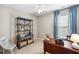 Bedroom with dark wood furniture, light walls, and bright blue curtains at 164 Owens Farm Ln, Woodstock, GA 30188