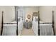 Bedroom with two twin beds, neutral walls, and plenty of natural light at 164 Owens Farm Ln, Woodstock, GA 30188