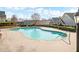 Sparkling community pool with clear blue water, surrounded by a well-kept patio at 164 Owens Farm Ln, Woodstock, GA 30188