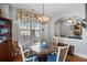 Charming dining room bathed in natural light from a large window at 164 Owens Farm Ln, Woodstock, GA 30188