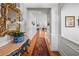 Elegant foyer with hardwood floors, console table, mirror, and views into other rooms at 164 Owens Farm Ln, Woodstock, GA 30188