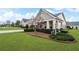 Beautiful house with a well maintained lawn and manicured landscaping at 164 Owens Farm Ln, Woodstock, GA 30188