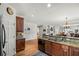 Open concept kitchen with great sightlines into the adjacent living spaces at 164 Owens Farm Ln, Woodstock, GA 30188