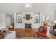 Cozy living room features a fireplace, built-ins, and hardwood flooring at 164 Owens Farm Ln, Woodstock, GA 30188