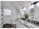 Bathroom featuring double sinks with granite countertops and modern fixtures, providing a luxurious feel at 1721 Mcgarity Rd, Temple, GA 30179