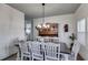 Elegant dining room with a large table, chandelier, and classic decor at 1721 Mcgarity Rd, Temple, GA 30179