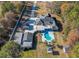 Aerial shot of home with an inviting private backyard pool, gazebo, extra garage and extra carport at 3410 Church Rd, Villa Rica, GA 30180