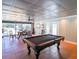 Entertainment room with a pool table, dining table, and tile floors at 3410 Church Rd, Villa Rica, GA 30180