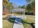 Picturesque gazebo with white pillars and decorative railing set within a lush backyard at 3410 Church Rd, Villa Rica, GA 30180