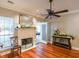 Cozy living room with a fireplace, hardwood floors, and natural lighting at 3410 Church Rd, Villa Rica, GA 30180